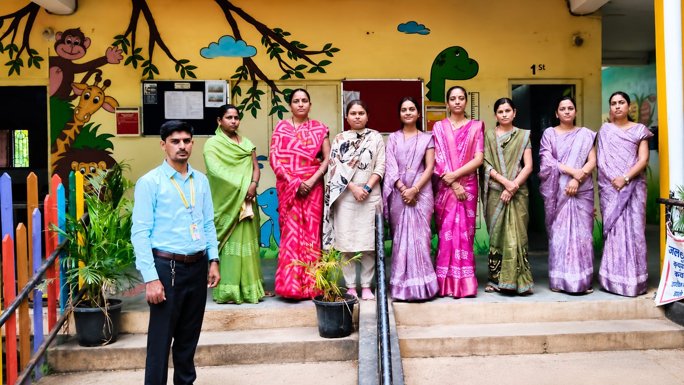 The teaching and support staff of The Future Step School outside the school building